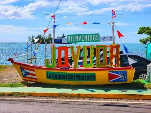 Colorful Joyuda welcome sign along the seafood coast of Cabo Rojo